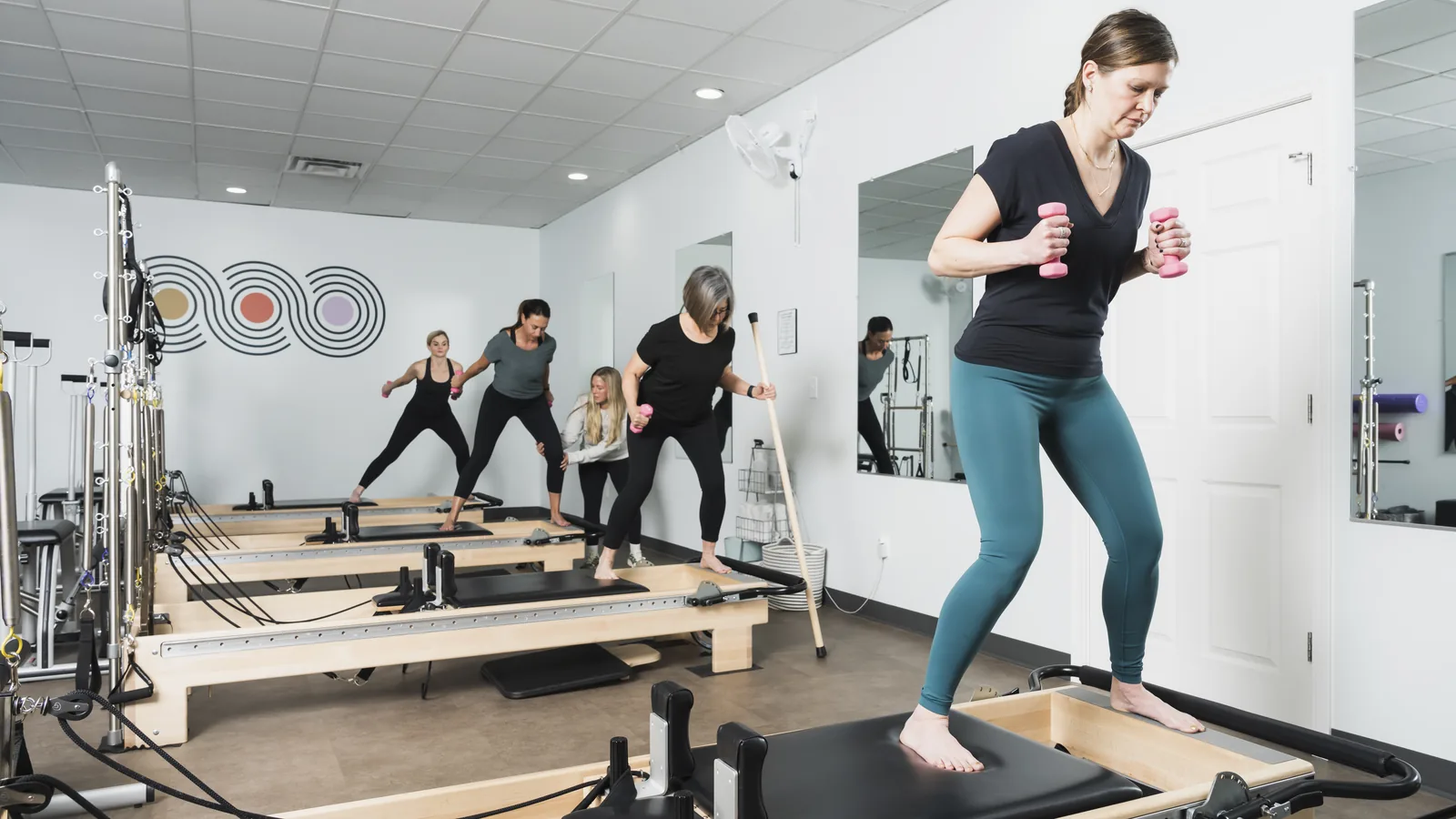 Clients working together in a small group class at Foundations Pilates and Wellness Studio in Indianapolis