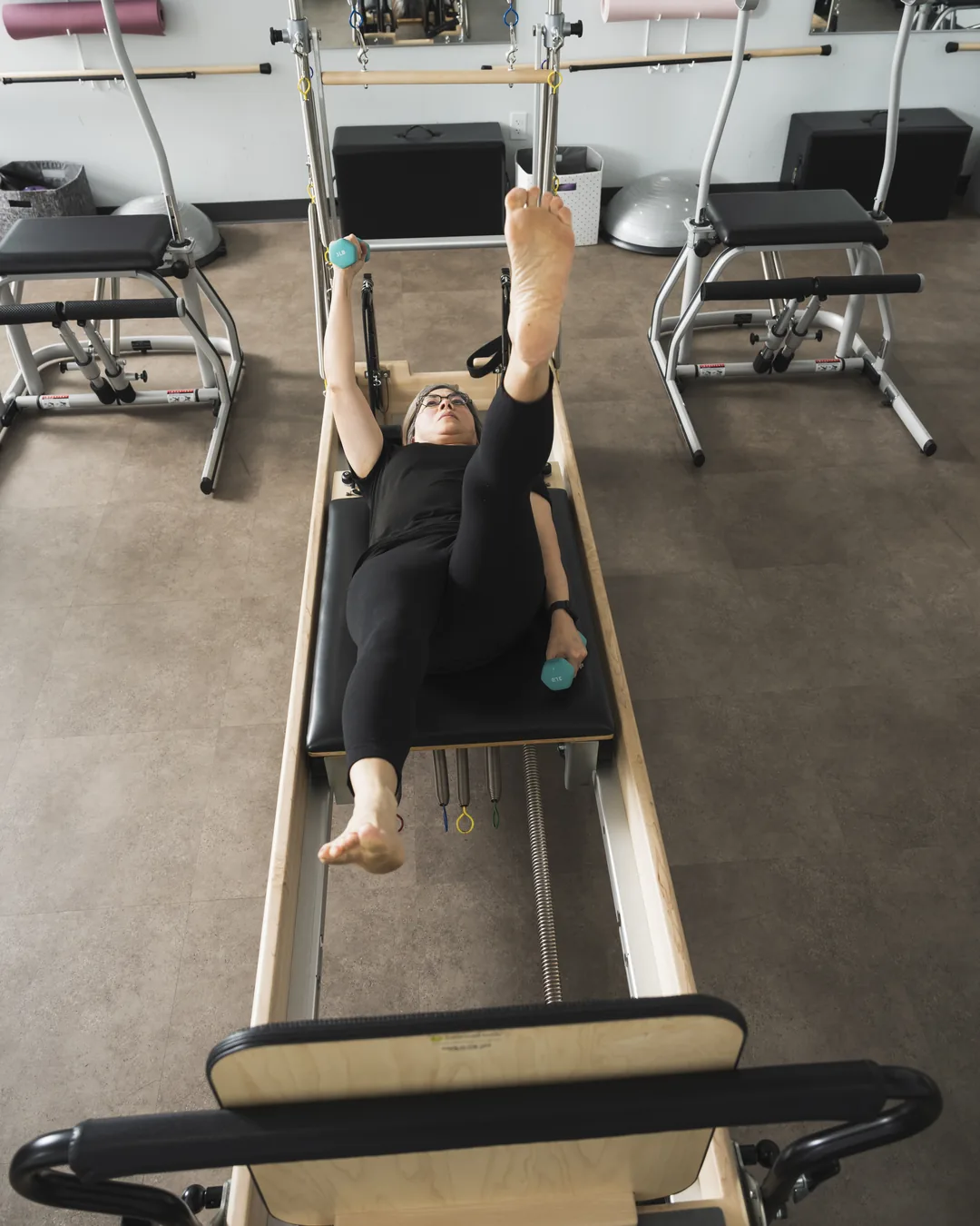 Client working through a controlled reformer exercise during a one-on-one session
